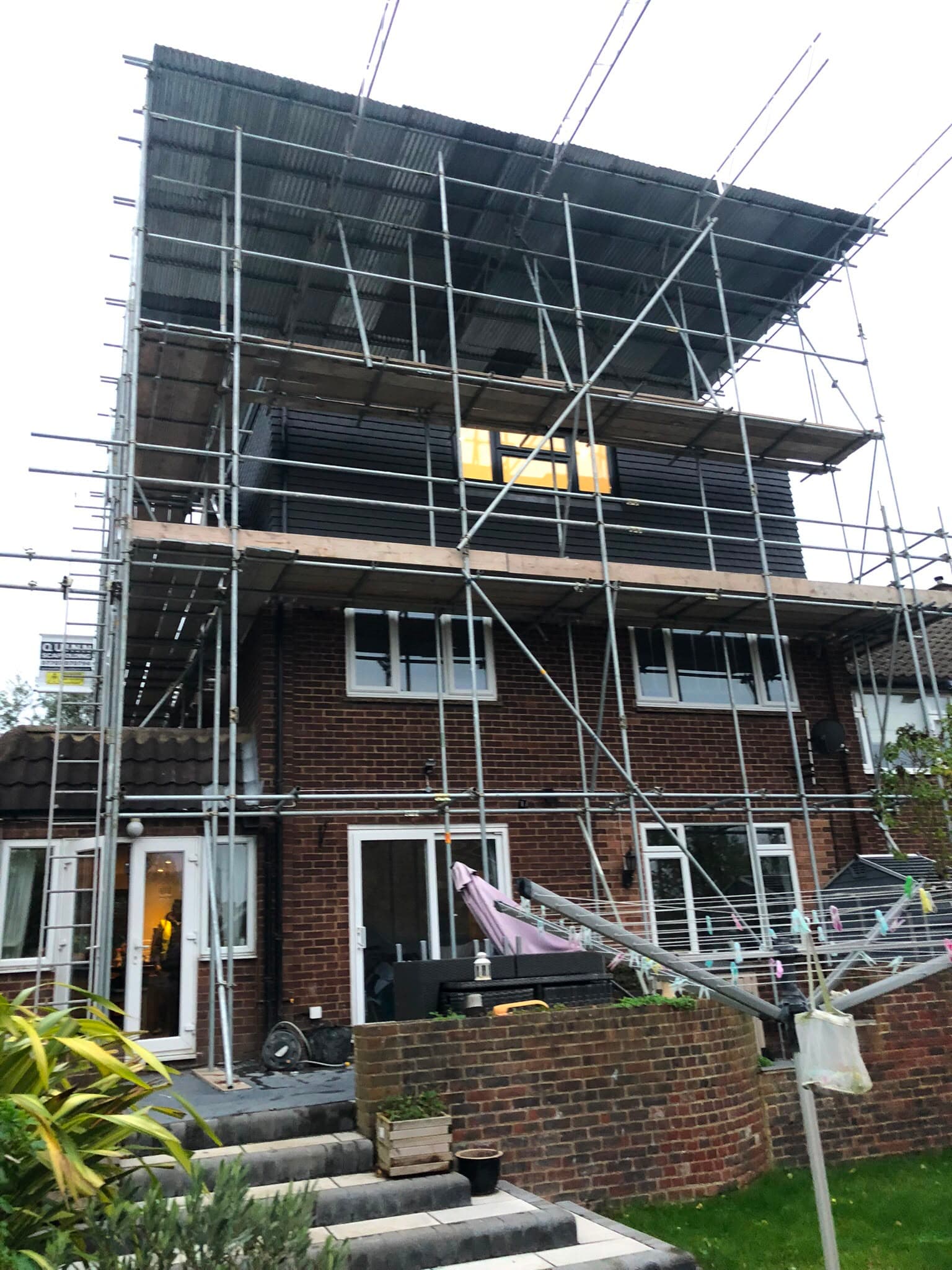 Full exterior property renovation with scaffolding