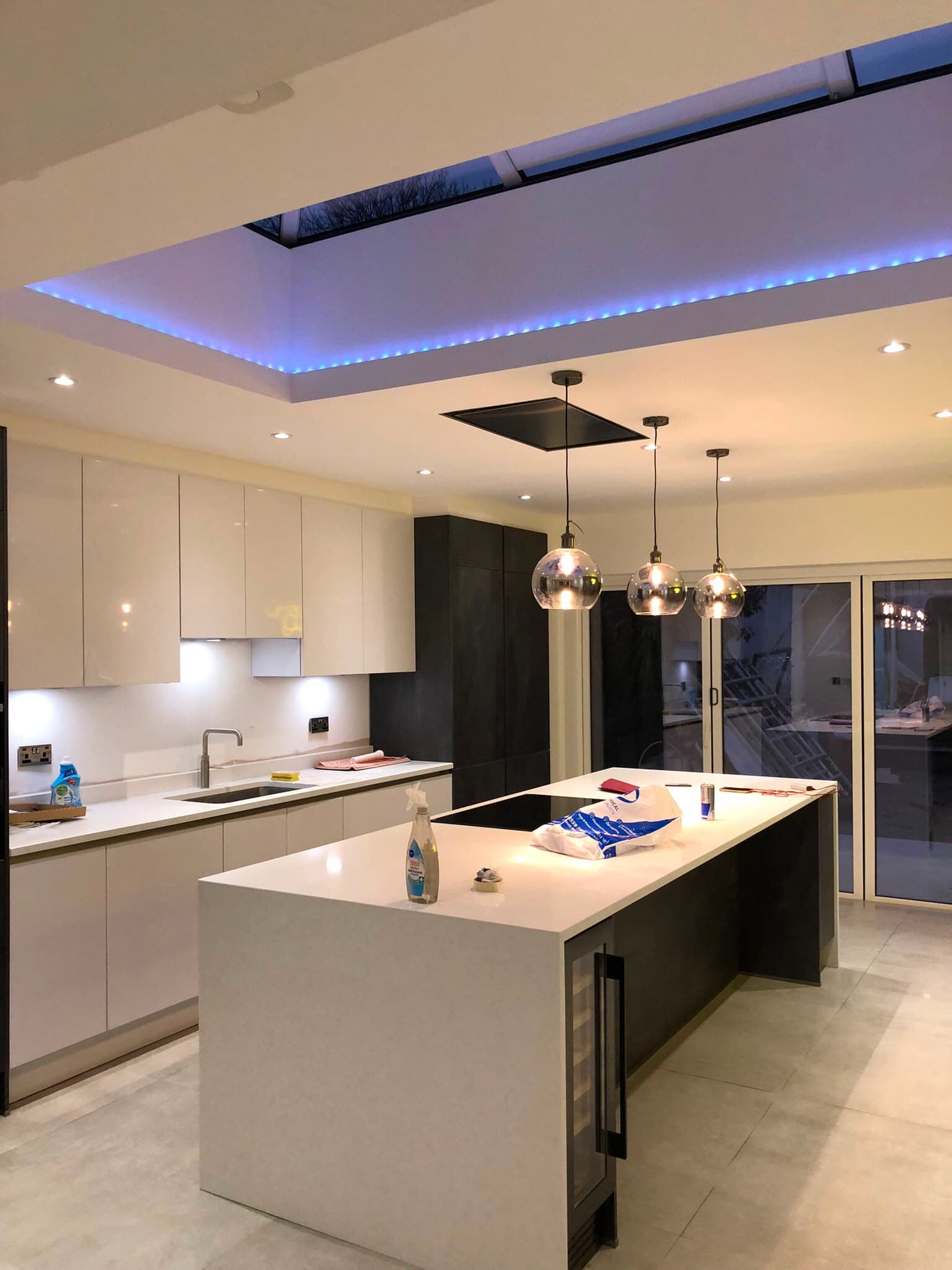 Completed modern kitchen with island and pendant lighting