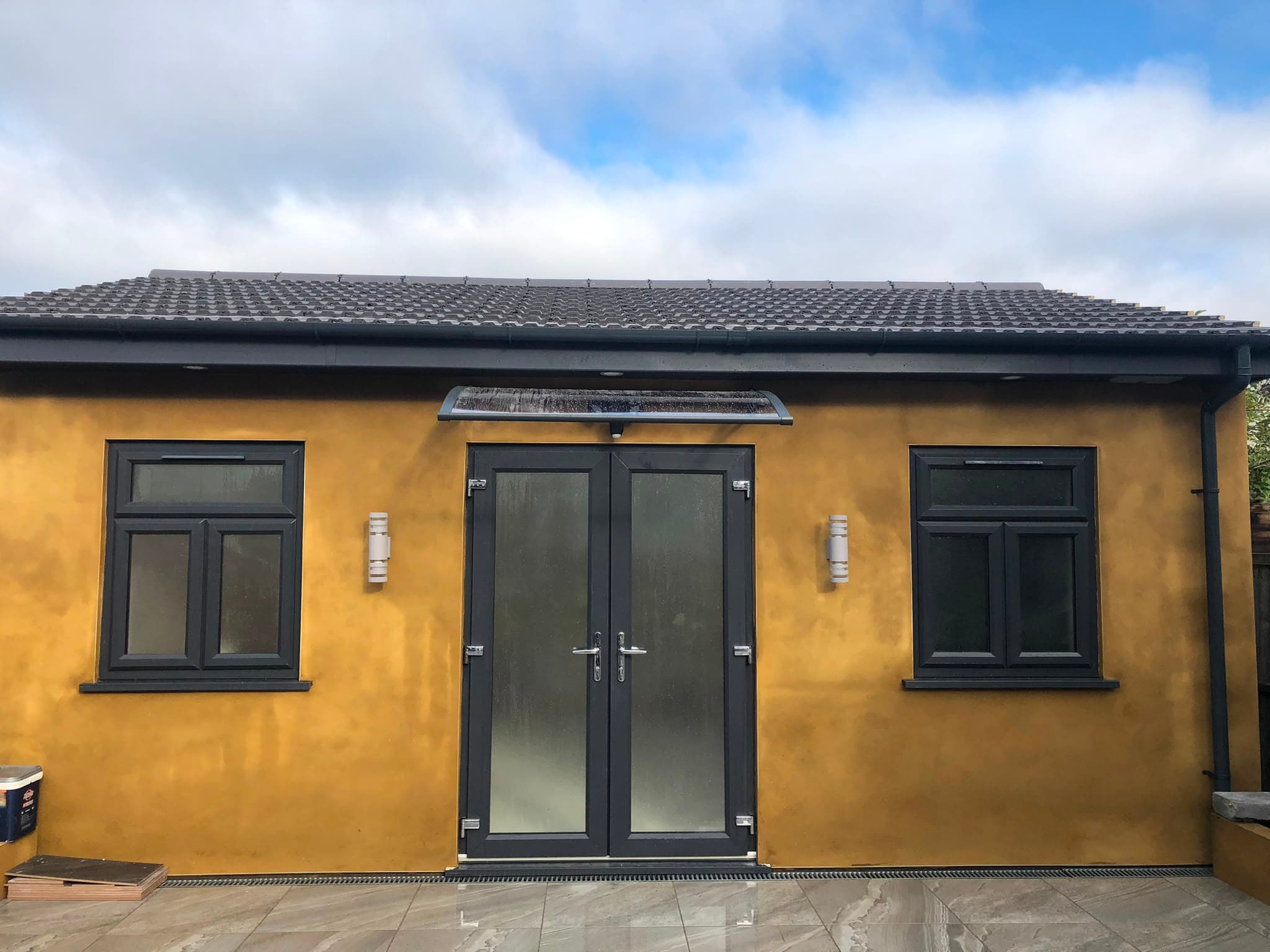 Completed garden building with a dark tiled roof