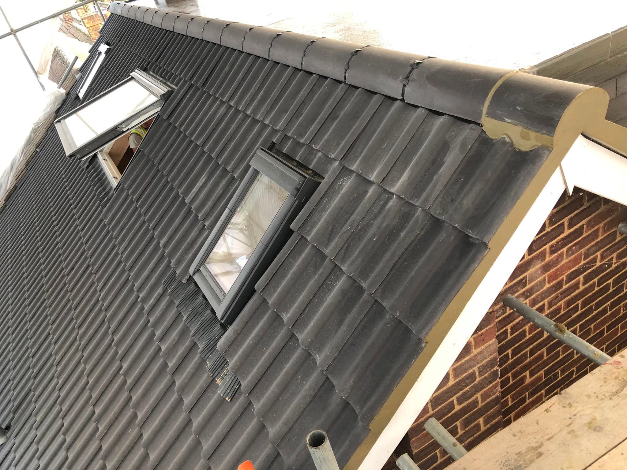 Completed tiled roof renovation with skylight